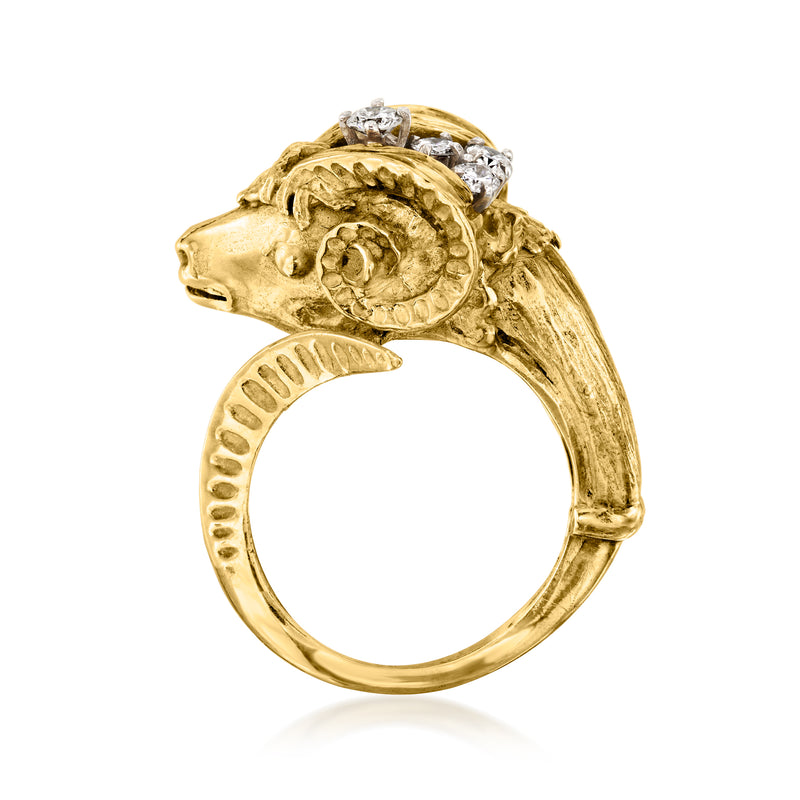 Gold ram head ring with round diamonds on the face; scalloped band detailing