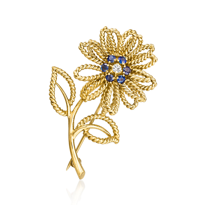 18kt yellow gold flower pin with blue sapphire petals and single diamond center