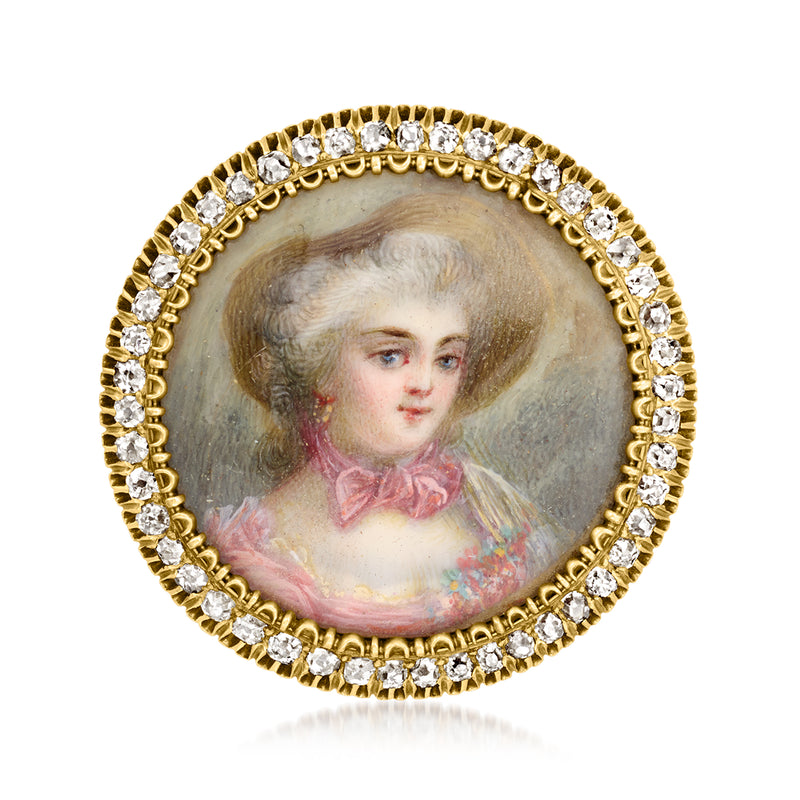 Enamel portrait pin: oval painted face, 15kt yellow gold with diamond trim