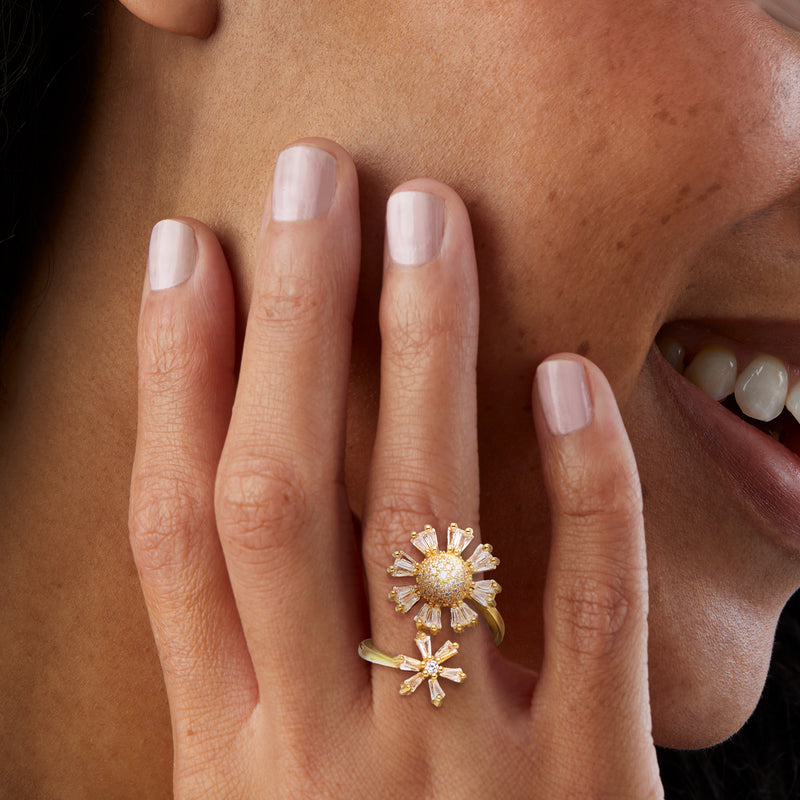 Gold-over-sterling CZ double-flower bypass ring worn on finger with clear stones