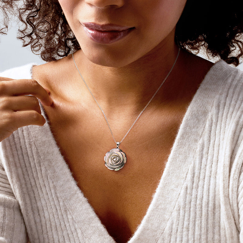 Sterling silver mother-of-pearl rose pendant on a thin chain necklace