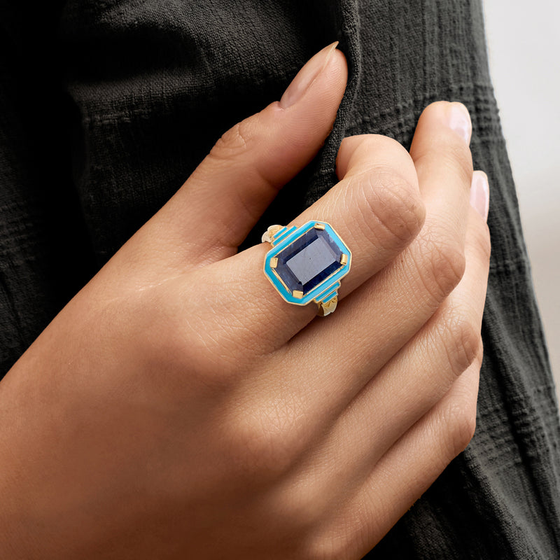 Blue sapphire-style octagon ring on hand, blue enamel bezel in gold over sterling