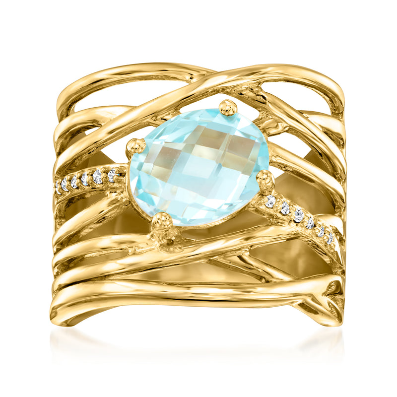 Gold crisscross ring with oval sky-blue gemstone and diamond accents, prong-set