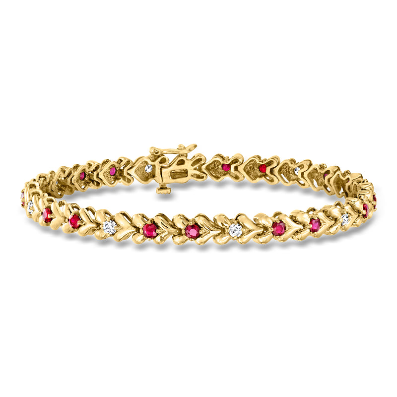 14kt yellow gold bracelet with ruby and diamond accents in repeating oval settings
