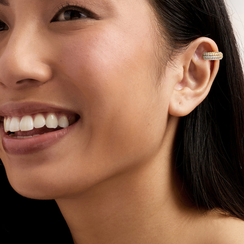 Gold over sterling pave CZ single ear cuff on ear with sparkling stones