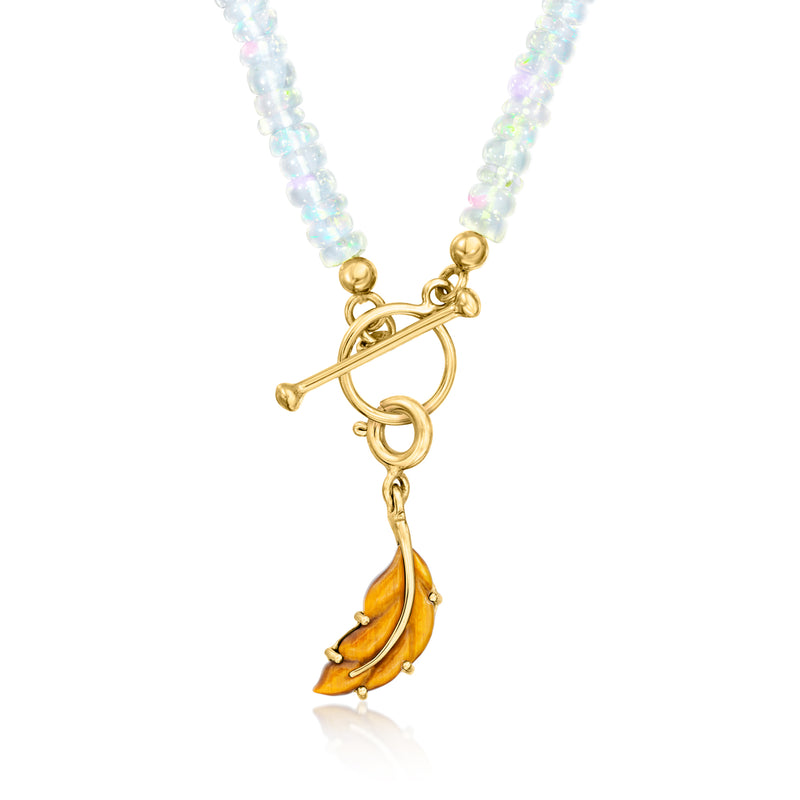 Gold over sterling tiger eye leaf charm on blue beaded necklace, pendant drop view