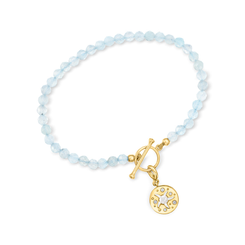 Aquamarine bead bracelet with gold toggle clasp and round charm