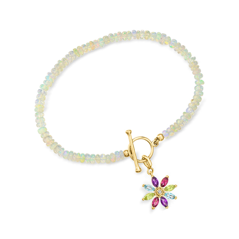 Opal bead charm toggle bracelet with gold toggle and purple flower charm