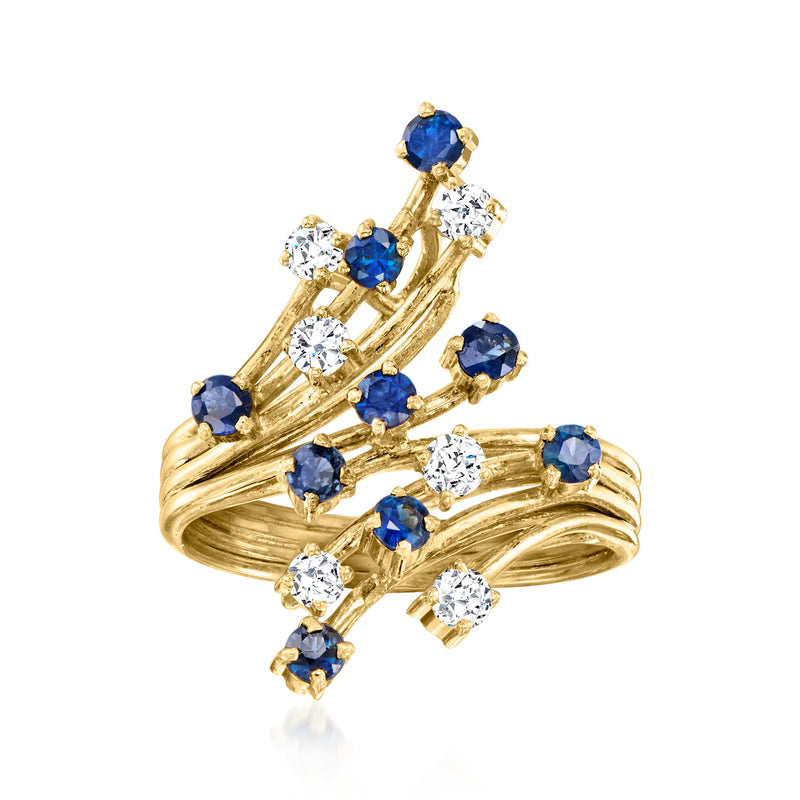 14kt yellow gold bypass ring with blue sapphires and clear diamond accents