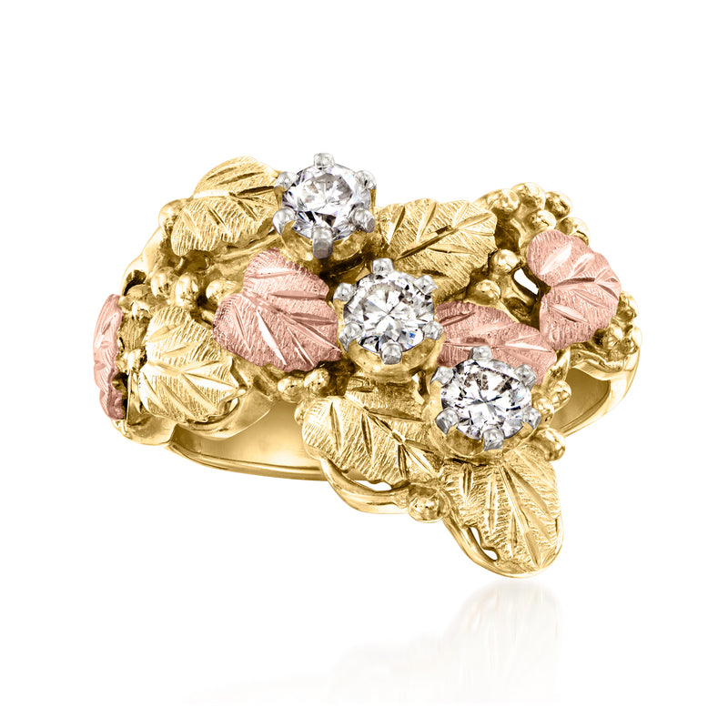 Two-tone gold leaf ring with round clear stones and pink centers, vintage style