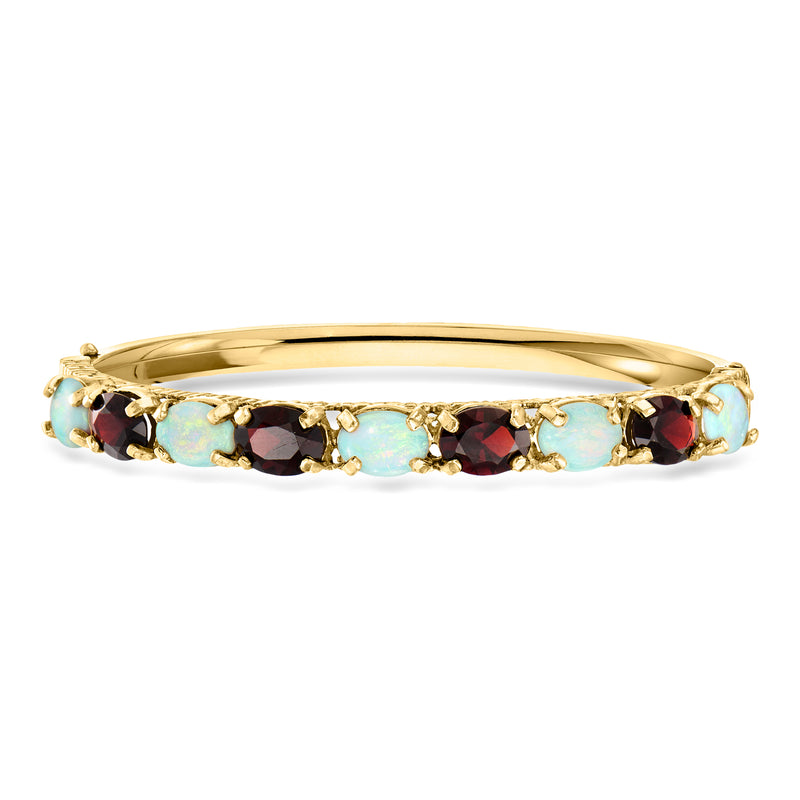 Yellow gold bangle bracelet with turquoise opal stones and dark red garnets