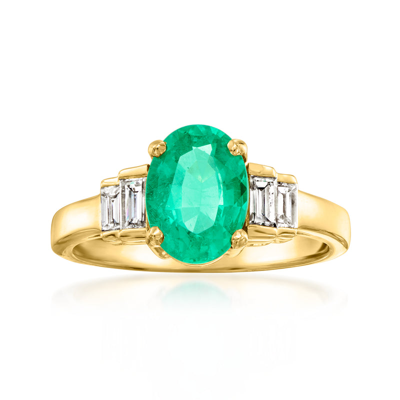 Vintage emerald ring in 18k yellow gold with oval green center and baguette diamond sides