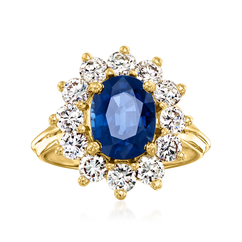 Vintage 14kt yellow gold ring with oval blue sapphire and round diamond halo