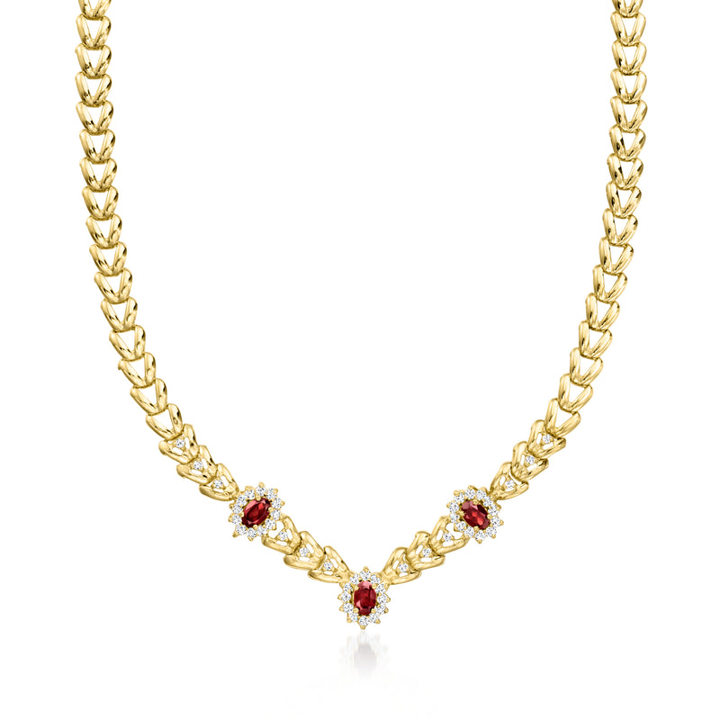 14kt yellow gold station necklace with red garnet drops and diamond accents, V shape