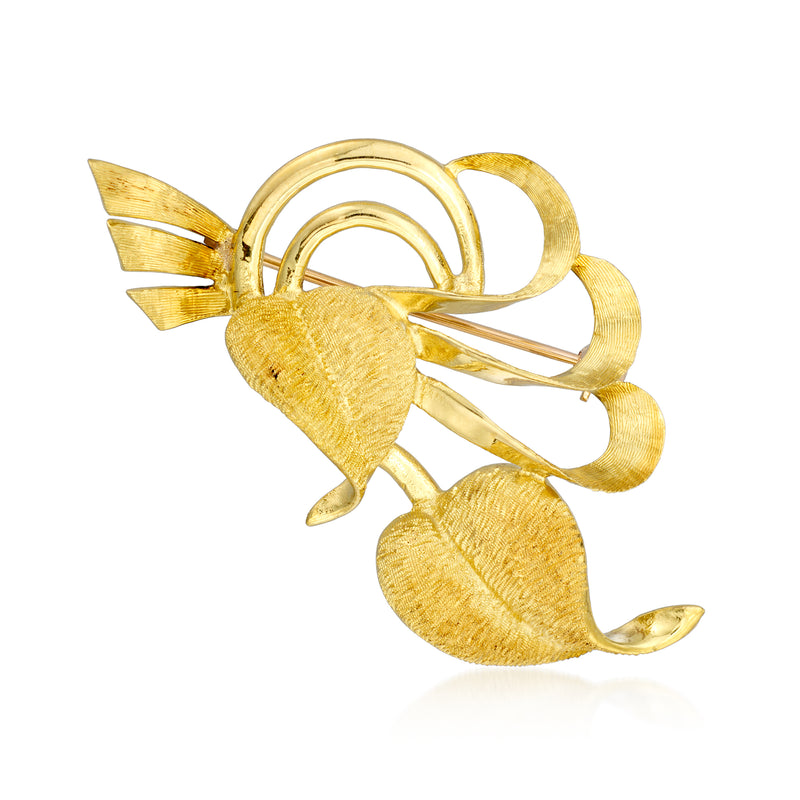 Vintage 18kt yellow gold swirl leaf pin with two leaf forms and circular detailing.