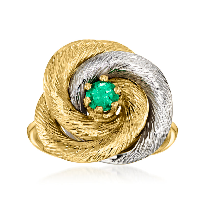 Two-tone gold knot ring with green emerald centerpiece, twisted oval design