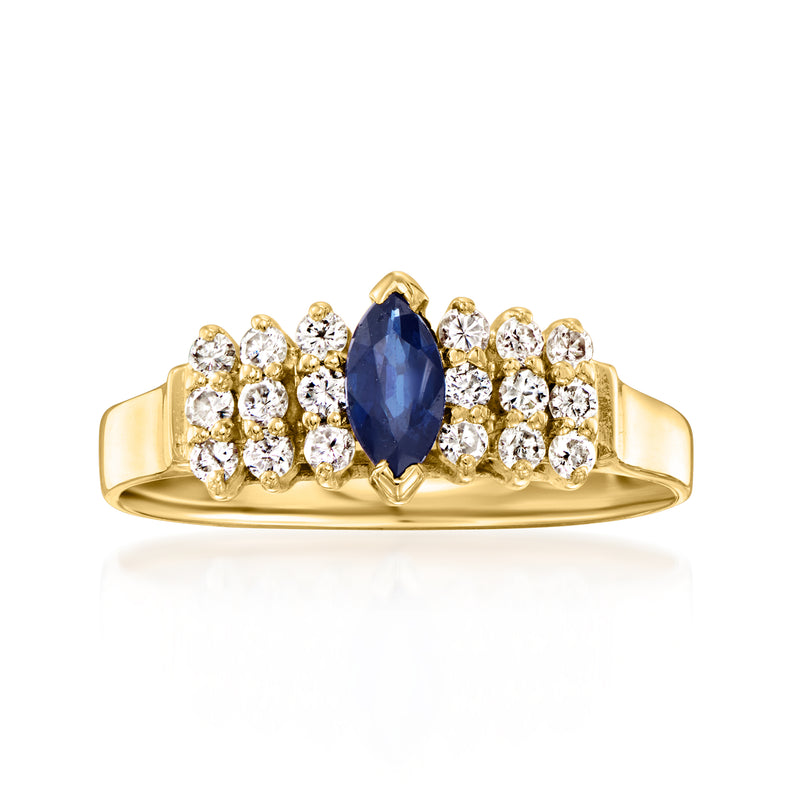 Vintage gold ring with oval blue sapphire center and round diamond halo and bands