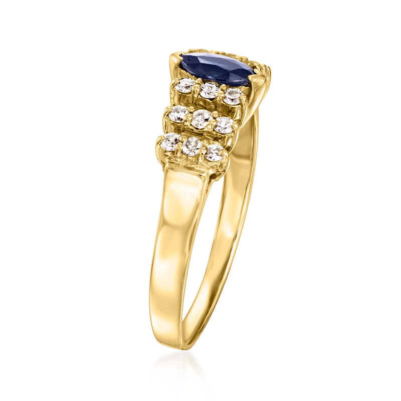 Gold vintage ring, oval blue sapphire on top with diamond side clusters