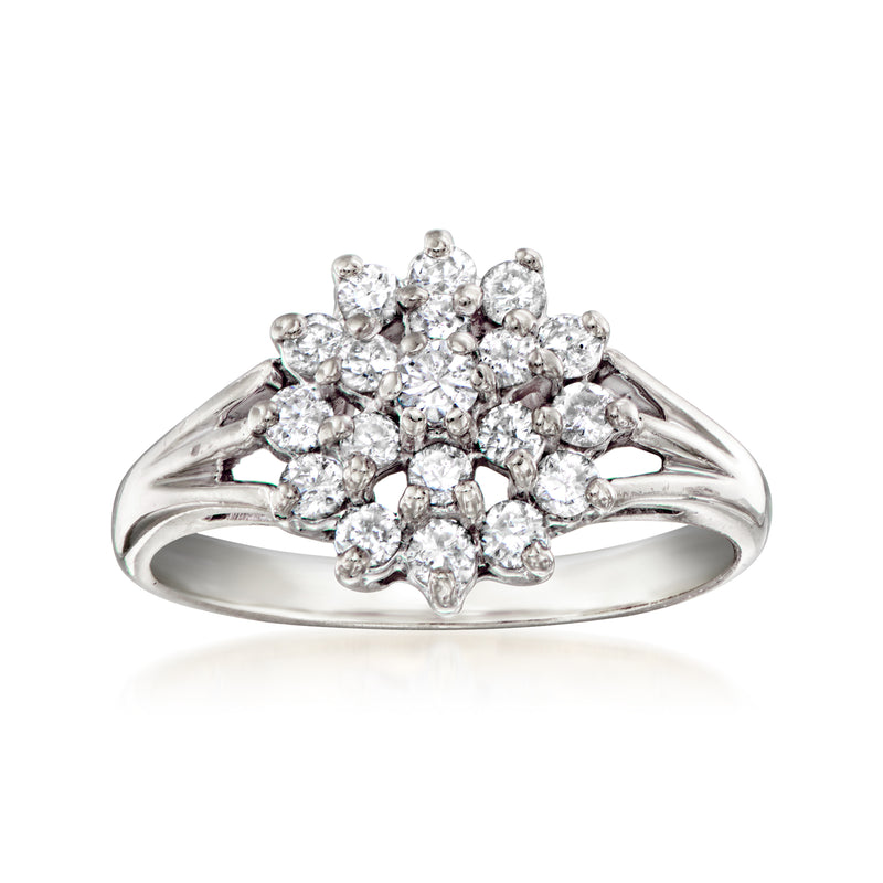 Vintage diamond cluster ring with round stones in 14kt white gold, sleek open band