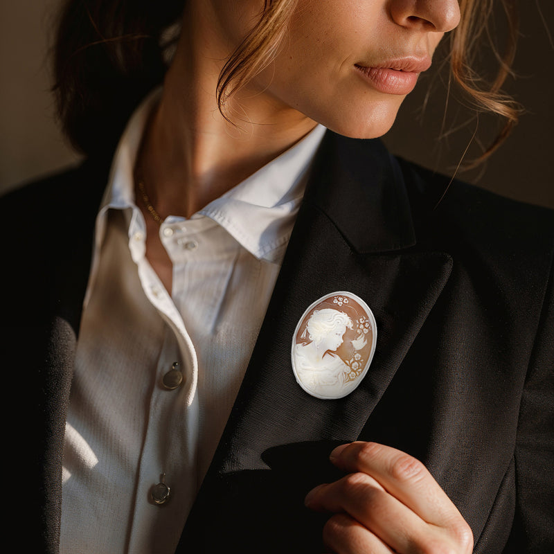 Oval shell cameo pin in platinum tone, white woman figure on brown background