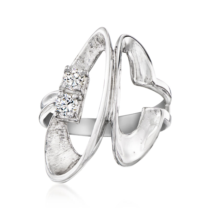 Vintage open-space diamond ring in 14kt white gold with three round stones