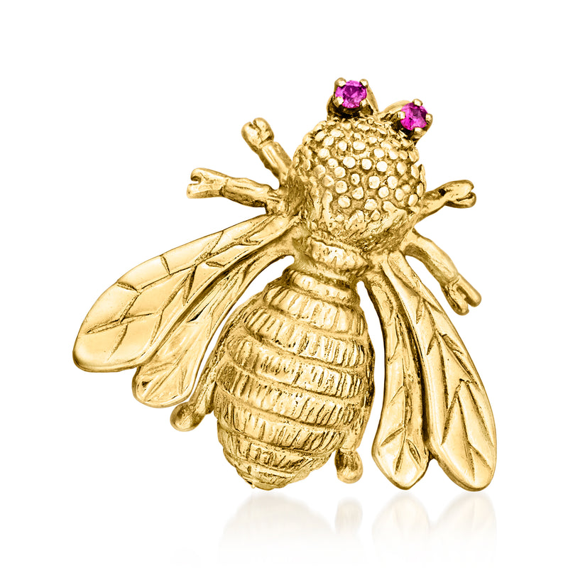 Yellow gold bee pin with raised wings and small purple ruby accents