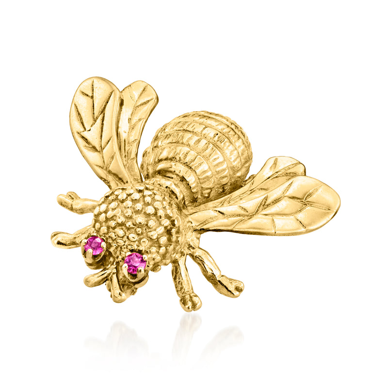 Yellow gold bee pin with textured body, wing veins, and purple ruby accents