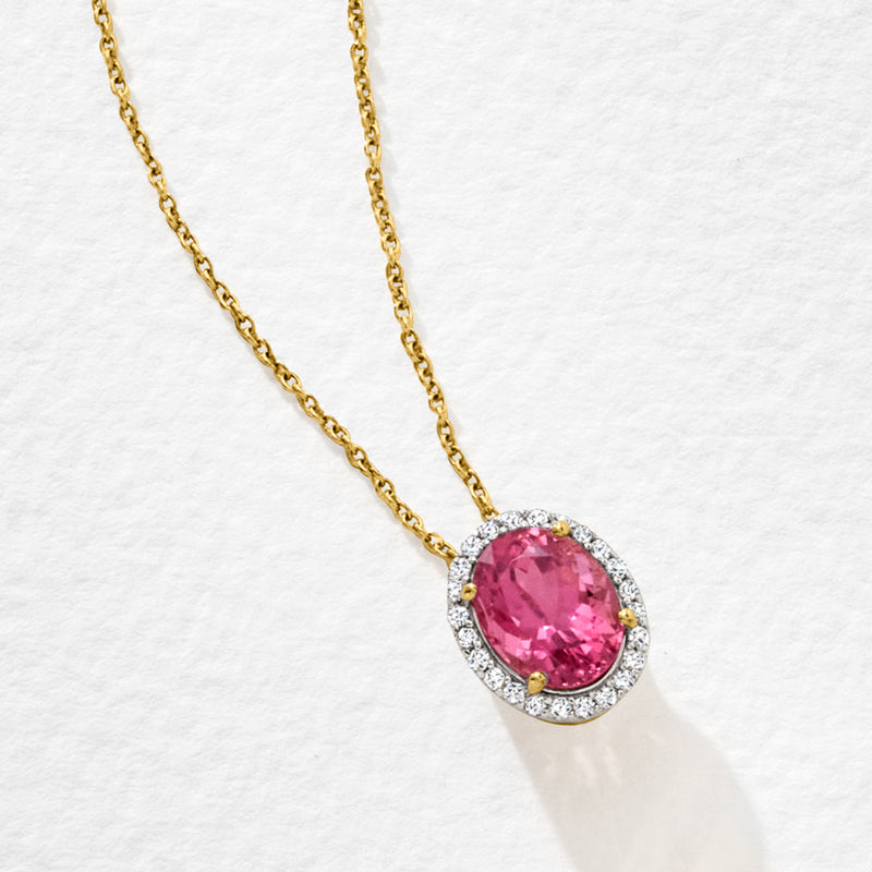 Yellow gold chain with pink oval tourmaline pendant and diamond halo