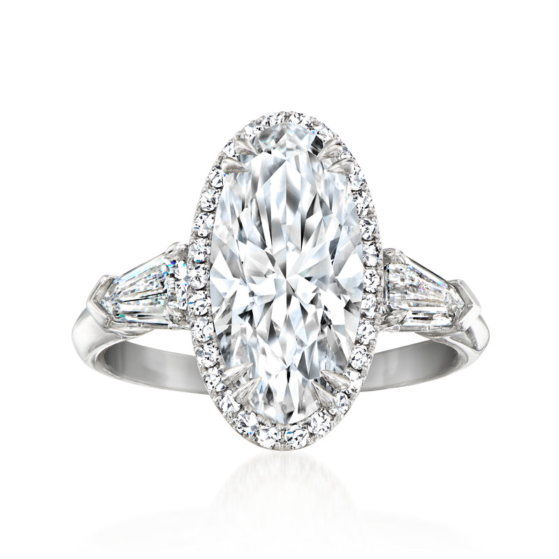Platinum lab-grown diamond ring with oval center stone and baguette side stones
