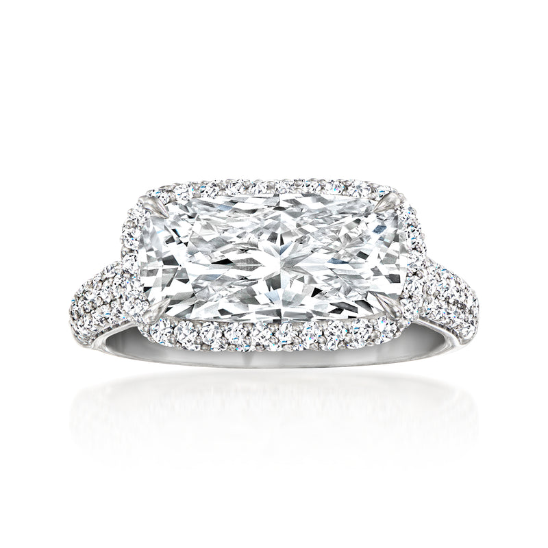 Platinum lab-grown diamond east-west ring with oval center and round pave halo
