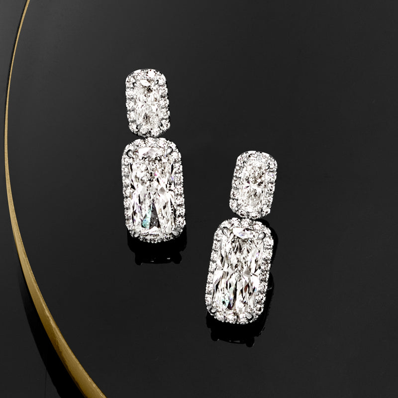Platinum cushion-cut diamond drop earrings with post backs, dangling stones