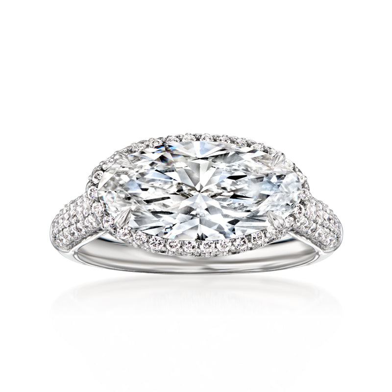 Platinum east-west oval diamond ring with pavé band