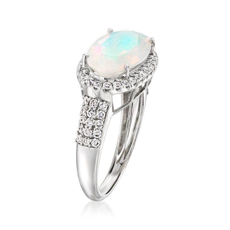 Side view of platinum diamond halo ring with oval opal-like center