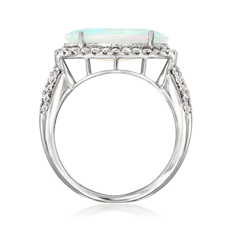 Top view of platinum ring featuring oval opal-like center and prong setting