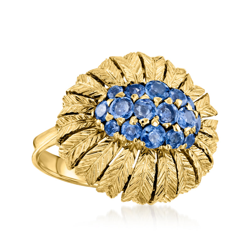 18kt yellow gold sapphire feather ring with blue round gemstone cluster and leaf-like bezel