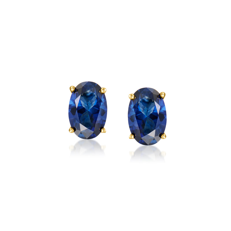 Oval blue sapphire stud earrings with gold prong settings