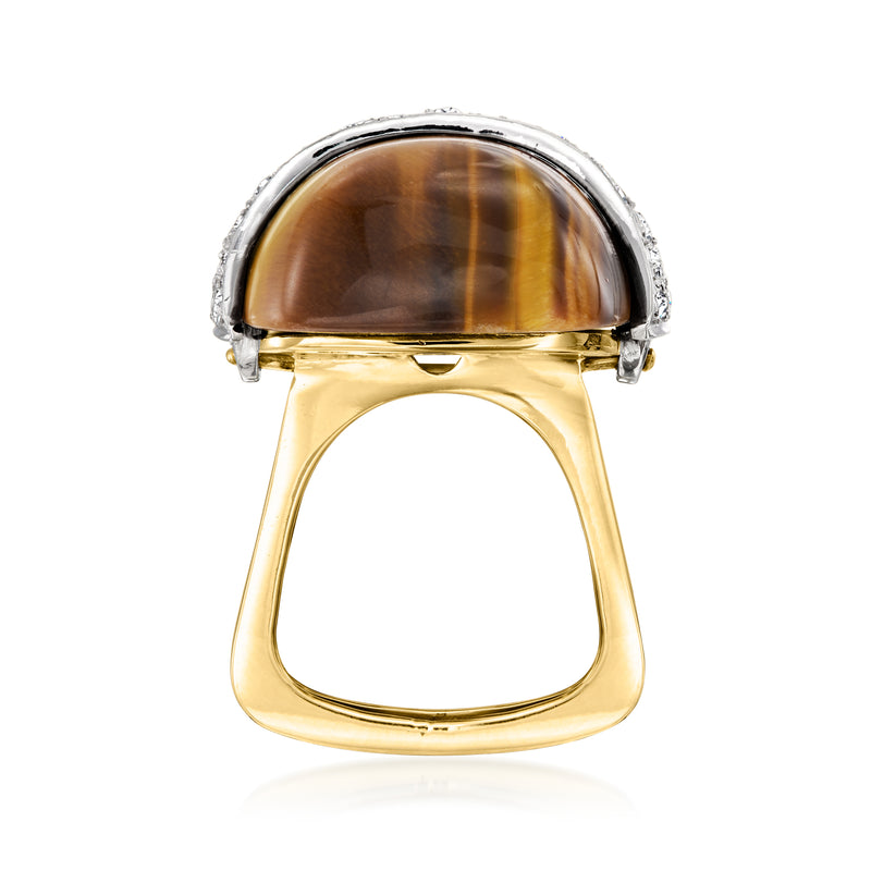 Two-tone gold ring with tiger eye cabochon in silver-toned diamond frame