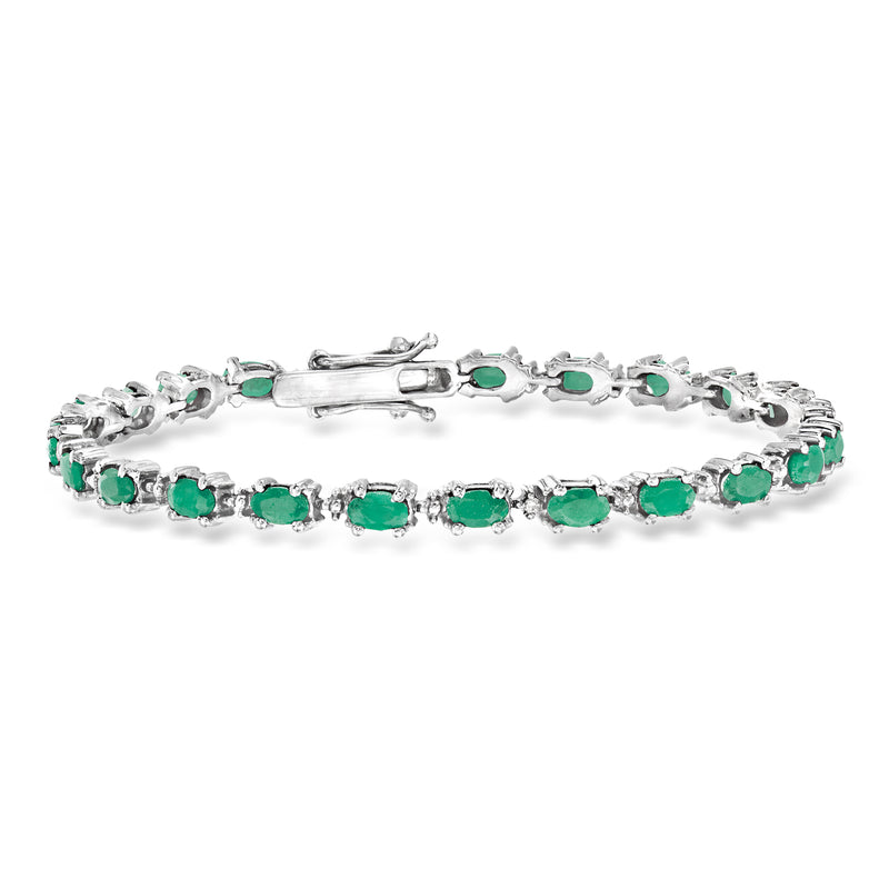 Sterling silver tennis bracelet with green oval emeralds and small clear diamonds