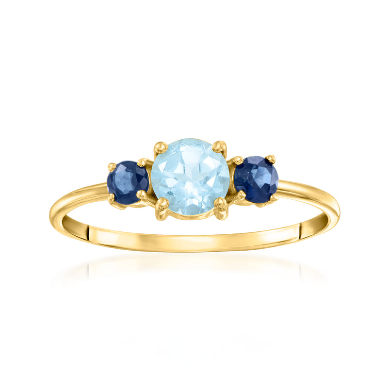 10kt yellow gold ring with oval sky blue topaz and two round sapphire accents