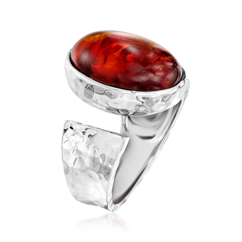 Sterling silver open-wrap ring with oval dark red cabochon, textured side band