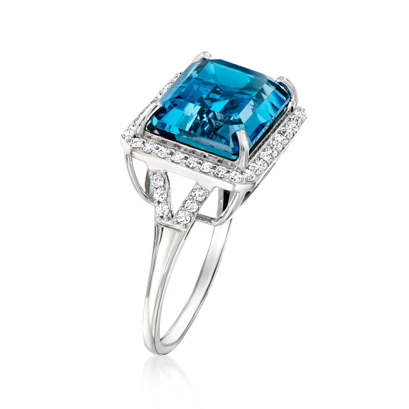 Side view platinum ring featuring an emerald-cut blue topaz center with diamonds