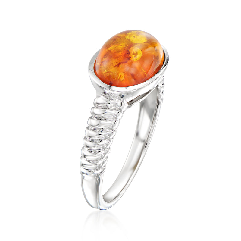 Sterling silver amber ring with oval amber cabochon and twisted wire band
