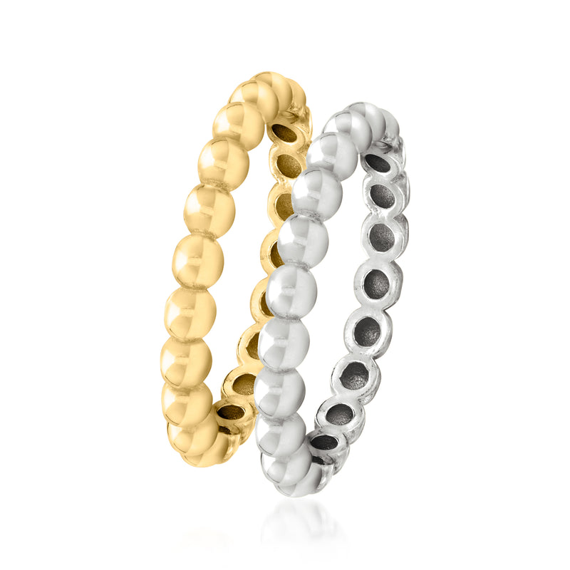 Two beaded rings in gold and silver tones, curved bands with round bead details