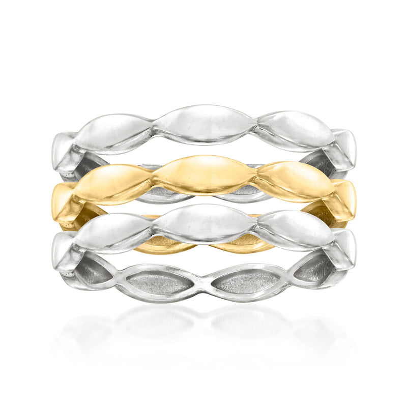 Three wave rings in silver and gold-tone metal, polished oval links in a stack