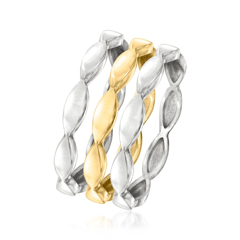 Stacked wave rings with alternating silver and gold-tone ovals, open band design
