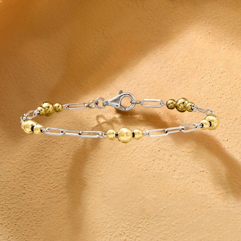 Sterling silver bracelet with gold-tone round beads and paper-clip links, clasp visible