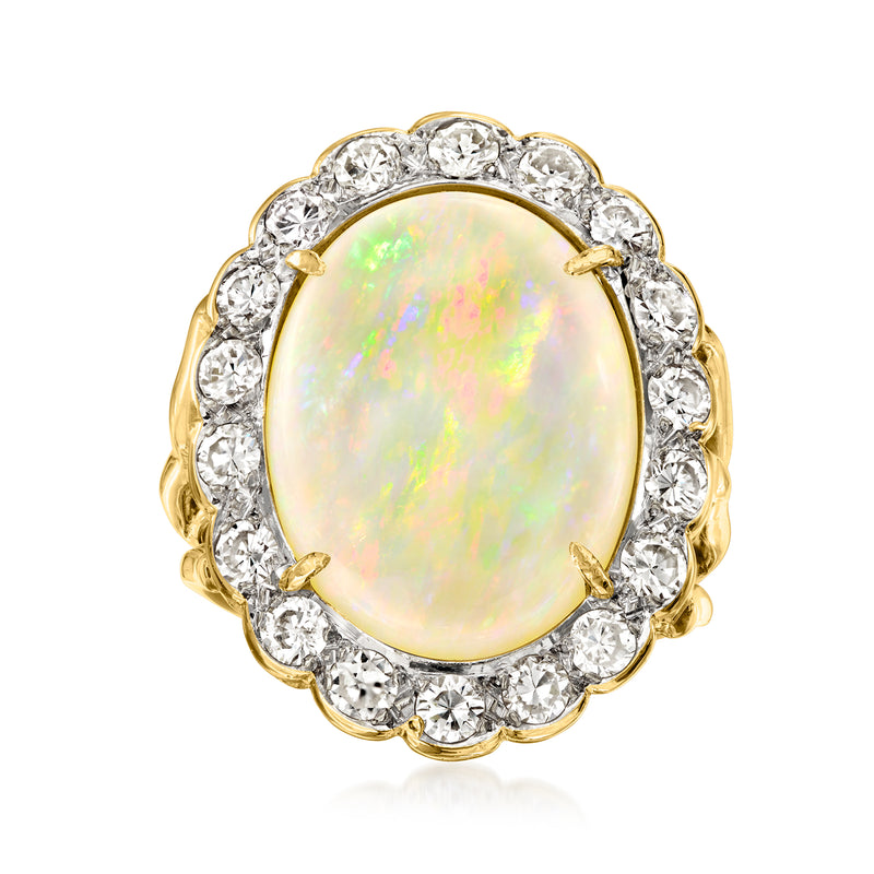 Yellow gold oval opal cocktail ring with diamond halo and scalloped bezel