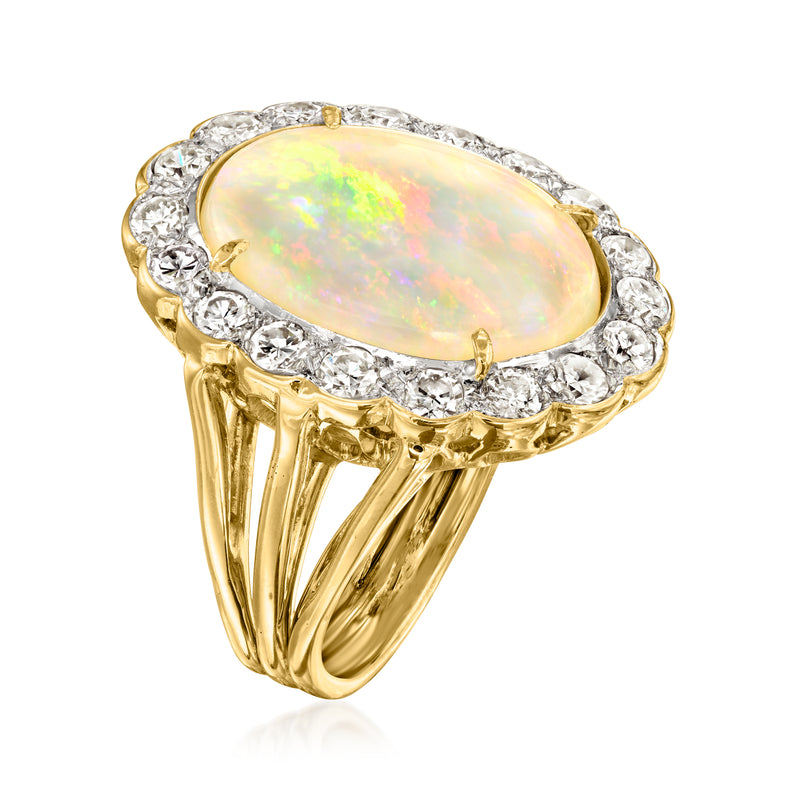 Yellow gold opal and diamond cocktail ring, oval center with raised prongs