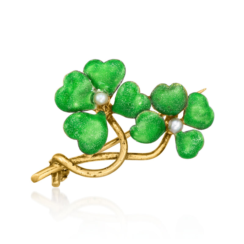 Vintage gold-tone clover pin with green enamel leaves and two seed-pearl accents