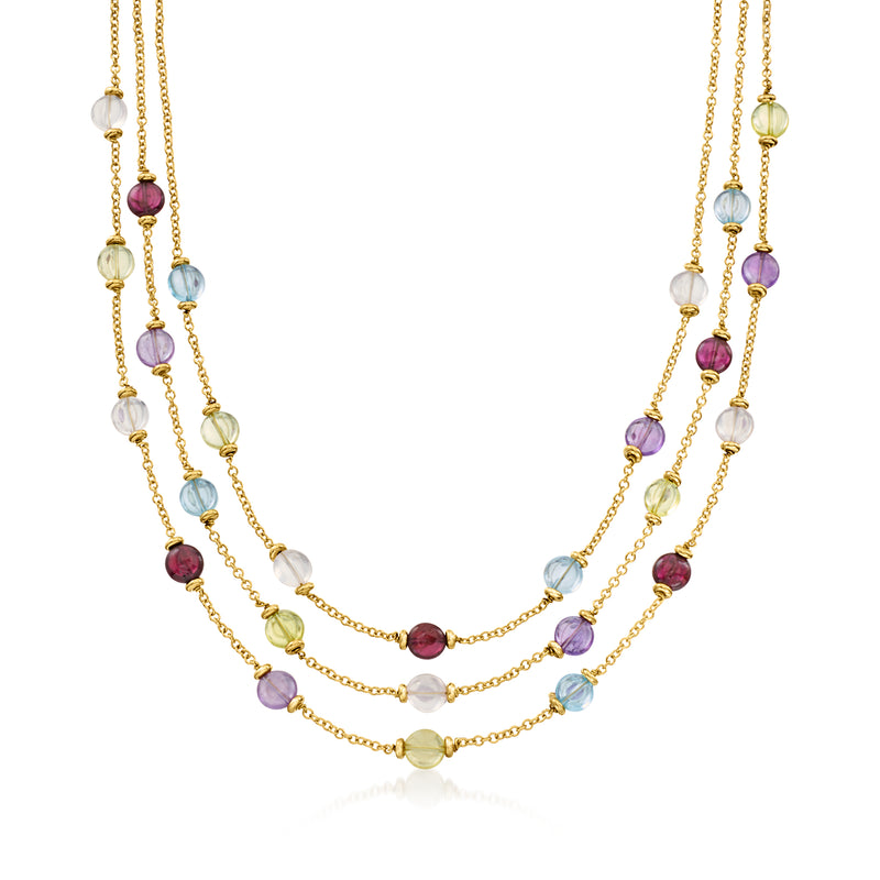 18kt yellow gold layered bead necklace with purple, blue, and clear gemstone accents